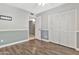 Empty bedroom with two-tone walls, hardwood floors, and closet space with bi-fold doors at 2741 S Brooks --, Mesa, AZ 85202