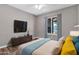 Staged bedroom featuring hardwood floors and bright window plus stylish furniture at 2741 S Brooks --, Mesa, AZ 85202