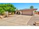Charming single-story home showcasing a brick facade, a spacious driveway, and mature trees in a well-maintained yard at 2741 S Brooks --, Mesa, AZ 85202