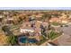 Spacious home with a large pool, outdoor seating area, well-maintained landscaping, and tile roof at 2782 E Citadel Ct, Gilbert, AZ 85298