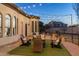 Charming backyard with string lights, a fire pit, and comfortable seating, perfect for enjoying evenings outdoors at 2782 E Citadel Ct, Gilbert, AZ 85298