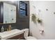Modern bathroom with vanity, gold hardware, a mirror, and black accent wall at 2782 E Citadel Ct, Gilbert, AZ 85298