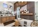 Stylish bathroom featuring a soaking tub, elegant lighting, and a modern vanity with decorative accents at 2782 E Citadel Ct, Gilbert, AZ 85298
