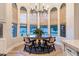 Charming dining area featuring a round table set by large windows, enhanced by woven blinds and stylish decor at 2782 E Citadel Ct, Gilbert, AZ 85298
