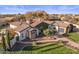 Beautiful exterior with manicured lawn, stone accents, tile roof, and attached garage at 2782 E Citadel Ct, Gilbert, AZ 85298