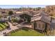 Stunning home with lush landscaping, a stone and tile roof, and an inviting brick driveway at 2782 E Citadel Ct, Gilbert, AZ 85298