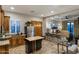 Open kitchen and bedroom suite area features modern appliances, island, and breakfast bar at 2782 E Citadel Ct, Gilbert, AZ 85298