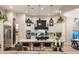 Spacious kitchen boasts a large island, custom cabinets, pendant lighting, and stainless steel appliances at 2782 E Citadel Ct, Gilbert, AZ 85298