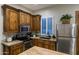 Well-equipped kitchen boasts stainless steel appliances, granite counters, and custom cabinets at 2782 E Citadel Ct, Gilbert, AZ 85298