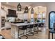 Open-concept kitchen with an oversized island, pendant lighting, and stainless steel appliances; perfect for entertaining at 2782 E Citadel Ct, Gilbert, AZ 85298