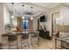 Bright living room features a granite bar area, tray ceiling, and outdoor access at 2782 E Citadel Ct, Gilbert, AZ 85298
