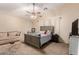 Serene bedroom with neutral tones, cozy carpeting, and a ceiling fan for comfort and relaxation at 2841 S Esmeralda Cir, Mesa, AZ 85212