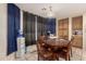 Bright dining area with a round wooden table, seating for six, and natural light at 2841 S Esmeralda Cir, Mesa, AZ 85212