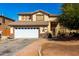 Charming two-story home with a two-car garage and well-maintained landscaping in a suburban neighborhood at 2841 S Esmeralda Cir, Mesa, AZ 85212
