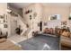 Bright living room with high ceilings, elegant staircase, tile floors, and large rug for a comfortable atmosphere at 2841 S Esmeralda Cir, Mesa, AZ 85212