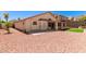 Backyard featuring gravel landscaping, covered patio and synthetic turf for a low maintenance space at 2904 E Ludlow Dr, Phoenix, AZ 85032