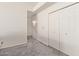 Bright bedroom featuring neutral paint, carpet flooring, and a spacious closet at 2904 E Ludlow Dr, Phoenix, AZ 85032