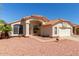 Charming single-Gathering home with desert landscaping, tile roof, and attached two-car garage at 2904 E Ludlow Dr, Phoenix, AZ 85032