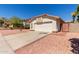 View of a single-Gathering home with desert landscaping, tile roof and two-car garage at 2904 E Ludlow Dr, Phoenix, AZ 85032