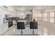 Bright kitchen featuring stainless steel appliances, white cabinets, and a tile backsplash at 2904 E Ludlow Dr, Phoenix, AZ 85032
