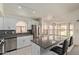 Modern kitchen featuring stainless steel appliances, white cabinetry, and a breakfast bar at 2904 E Ludlow Dr, Phoenix, AZ 85032