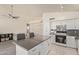 Bright, modern kitchen with stainless steel appliances, white cabinets, and a functional center island at 2904 E Ludlow Dr, Phoenix, AZ 85032