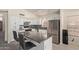 Modern kitchen with a central island, stainless steel appliances, and white cabinets at 2904 E Ludlow Dr, Phoenix, AZ 85032