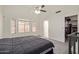 Spacious main bedroom offering large window, plush carpet, and access to a walk-in closet at 2904 E Ludlow Dr, Phoenix, AZ 85032