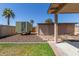 Backyard featuring gravel ground cover and multiple buildings, including a trailer at 3301 E Sharon Dr, Phoenix, AZ 85032