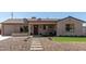 Charming home showcasing desert landscaping and a stone pathway leading to the cozy front porch at 3301 E Sharon Dr, Phoenix, AZ 85032