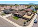 This home features an extended driveway, desert landscaping, mountain views, and a detached garage at 3301 E Sharon Dr, Phoenix, AZ 85032