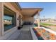 Inviting front porch with stylish seating and charming desert-inspired landscaping at 3301 E Sharon Dr, Phoenix, AZ 85032