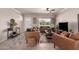 Stylishly furnished living room showcasing neutral colors, plush seating, and a bright window at 3301 E Sharon Dr, Phoenix, AZ 85032