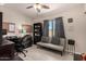 Functional home office with ample desk space, storage, and comfortable seating at 3301 E Sharon Dr, Phoenix, AZ 85032