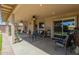 Covered patio featuring ceiling fans, comfortable seating, and decorative rugs at 3301 E Sharon Dr, Phoenix, AZ 85032