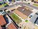 An aerial view of this home's roof and backyard, including a covered patio and fire pit at 3301 E Sharon Dr, Phoenix, AZ 85032