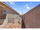 View of the home's backyard, featuring a stone pathway and block wall for added privacy at 3443 E Thornton Ave, Gilbert, AZ 85297