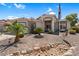 Charming single-story home with desert landscaping, palm trees and a welcoming facade at 3443 E Thornton Ave, Gilbert, AZ 85297