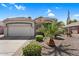 Inviting single-story home featuring a spacious driveway, desert landscape, and well-kept lawn at 3443 E Thornton Ave, Gilbert, AZ 85297