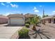 Inviting single-story home featuring a spacious driveway, desert landscape, and well-kept lawn at 3443 E Thornton Ave, Gilbert, AZ 85297