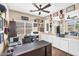 This office features wood-style floors, a ceiling fan, and built-in cabinets and drawers at 3443 E Thornton Ave, Gilbert, AZ 85297