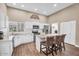 Bright kitchen featuring white cabinets, stainless steel appliances, and an island with seating at 3443 E Thornton Ave, Gilbert, AZ 85297