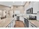 Modern kitchen with granite countertops, stainless steel appliances, and updated finishes at 3443 E Thornton Ave, Gilbert, AZ 85297