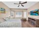 Stylish bedroom with a decorative bedspread, a ceiling fan, and neutral paint colors at 3443 E Thornton Ave, Gilbert, AZ 85297
