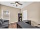 Comfortable office space with a cozy gray couch and a functional desk for working from home at 3443 E Thornton Ave, Gilbert, AZ 85297