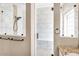 This shower features marble-style walls, glass doors, and a built-in bench at 3443 E Thornton Ave, Gilbert, AZ 85297