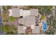 Breathtaking aerial view of luxury home featuring a sparkling pool and meticulously landscaped backyard at 36389 N 105Th Pl, Scottsdale, AZ 85262