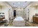 Expansive bathroom boasts a soaking tub, glass shower, tiled floors, and private toilet and grooming areas at 36389 N 105Th Pl, Scottsdale, AZ 85262
