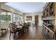 Formal dining room boasts wood floors, a long table set for ten, and a charming wine bar at 36389 N 105Th Pl, Scottsdale, AZ 85262