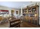 Well-lit dining room with hardwood floors and a rustic hutch offering ample storage at 36389 N 105Th Pl, Scottsdale, AZ 85262